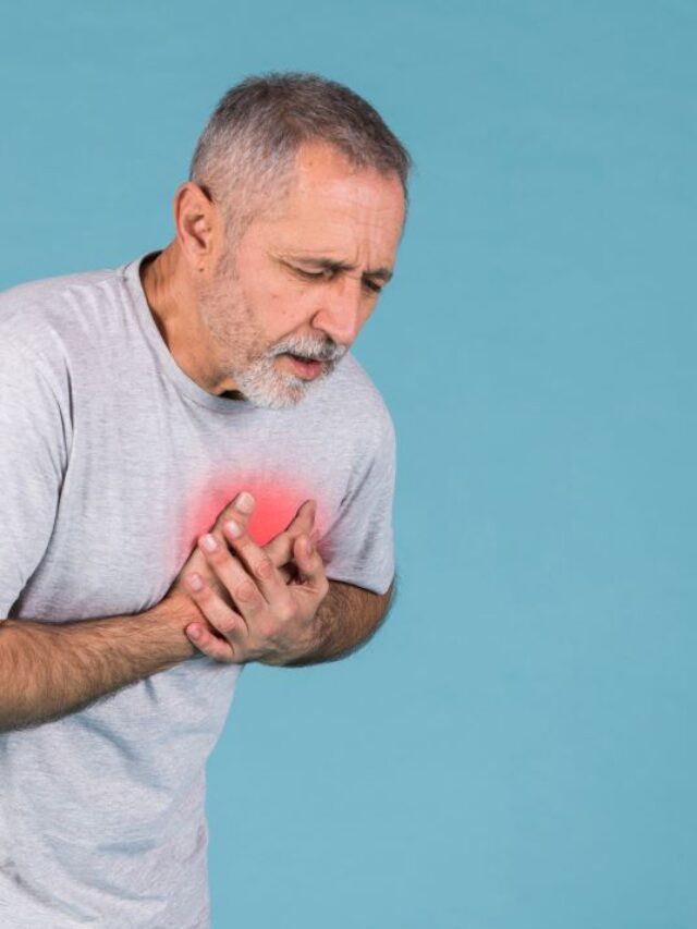 senior-man-having-chest-pain-blue-background