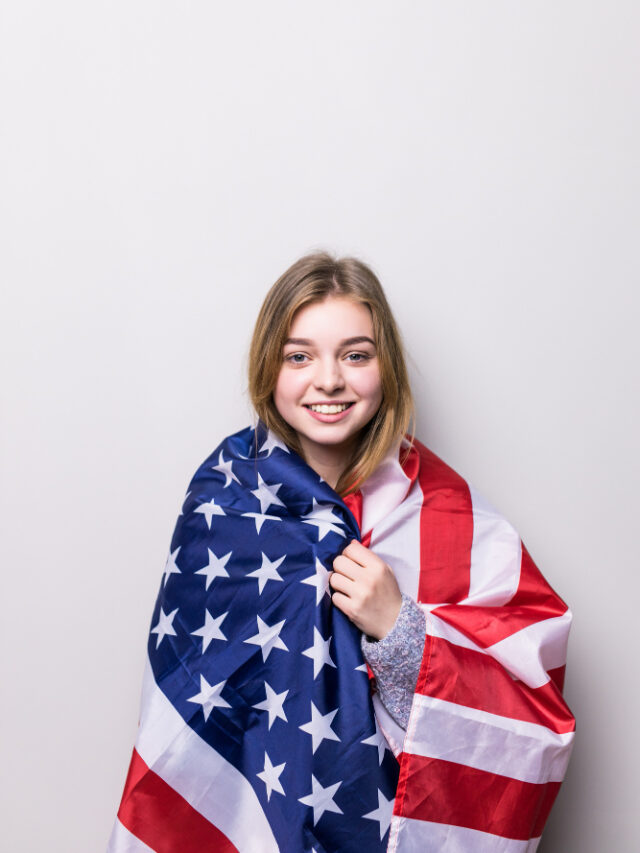 student-girl-holding-american-flag-isolated