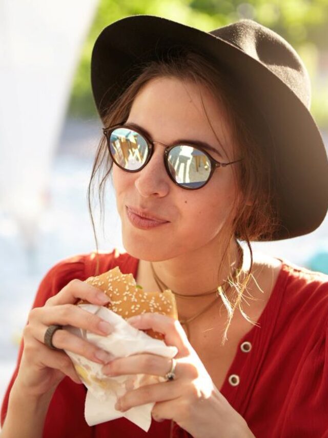 stylish-woman-wearing-red-blouse-big-hat