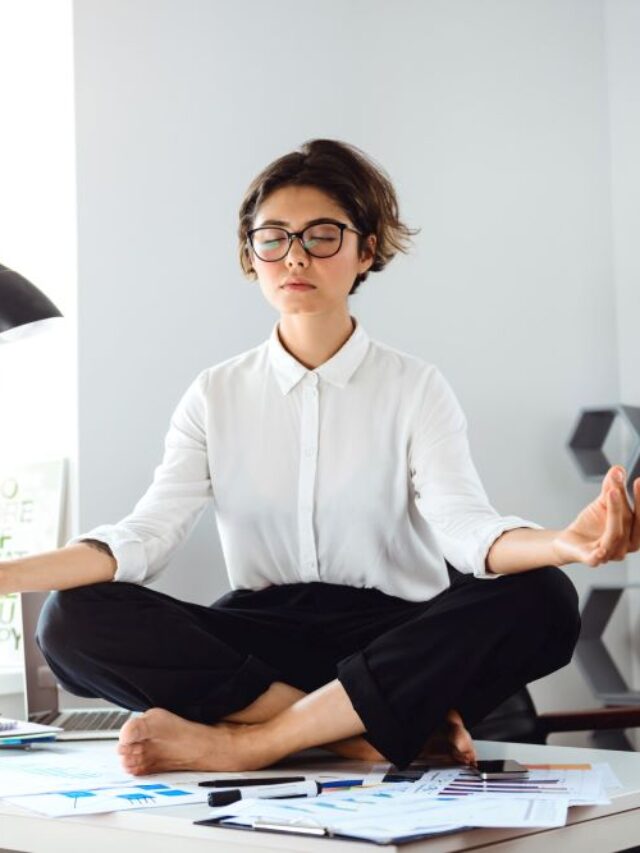 young-beautiful-businesswoman-meditating-table-workplace-office