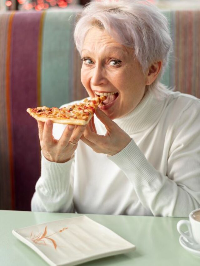 high-angle-senior-female-restaurant-eating