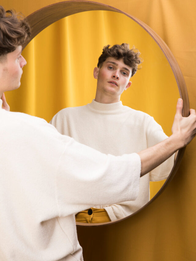 portrait-fashionable-boy-front-mirror