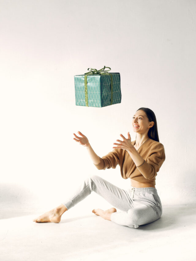 beautiful-girl-standing-studio-with-presents