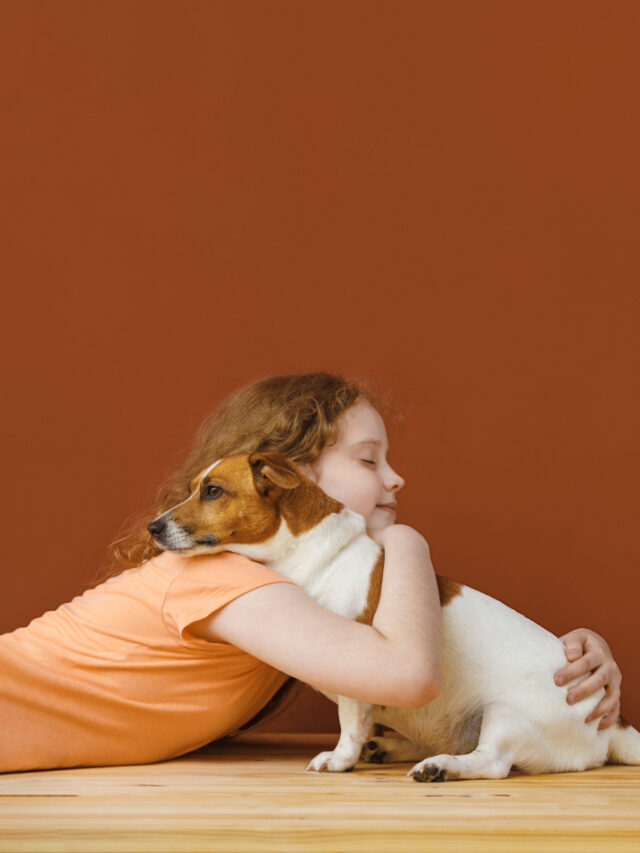 curly-girl-embracing-her-friend-dog