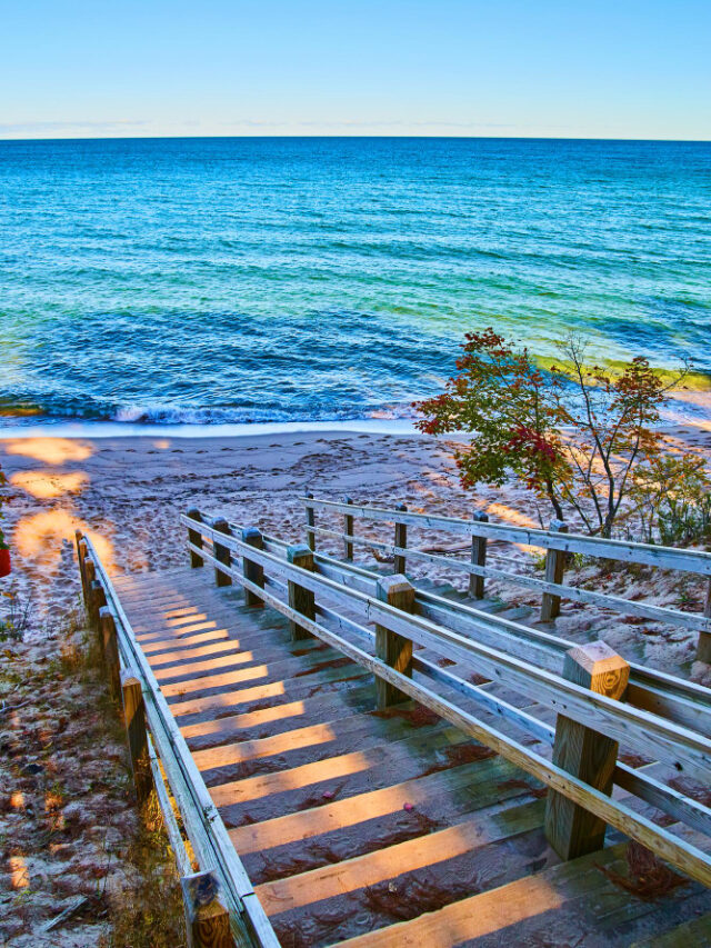 large-lake-ocean-with-stair-walkway-leading-distant-shore