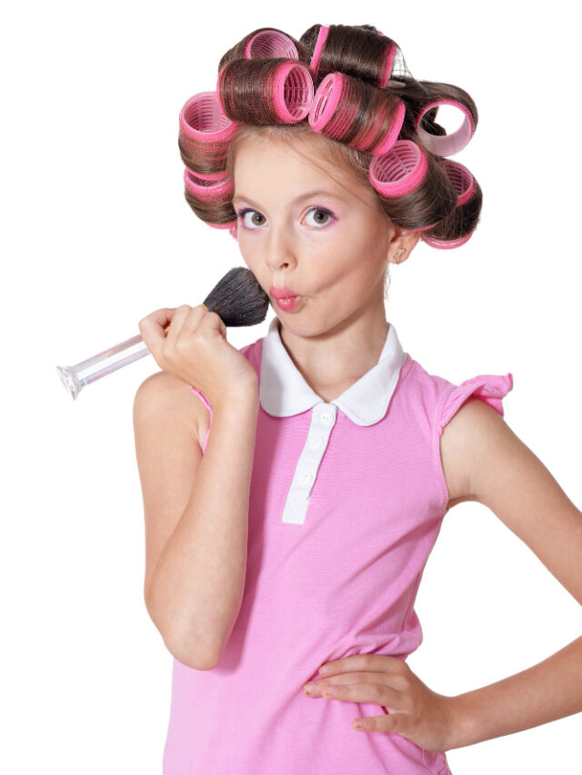 portrait-happy-little-pretty-girl-hair-curlers-studio