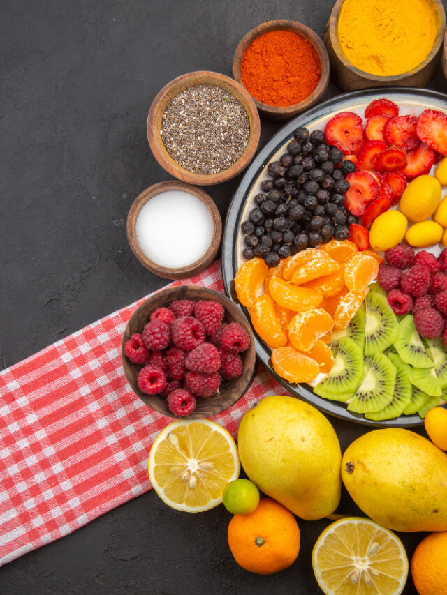 top-view-delicious-sliced-fruits-inside-plate-with-fresh-fruits-dark-fruit-exotic-photo-mellow-tree-ripe-healthy-life