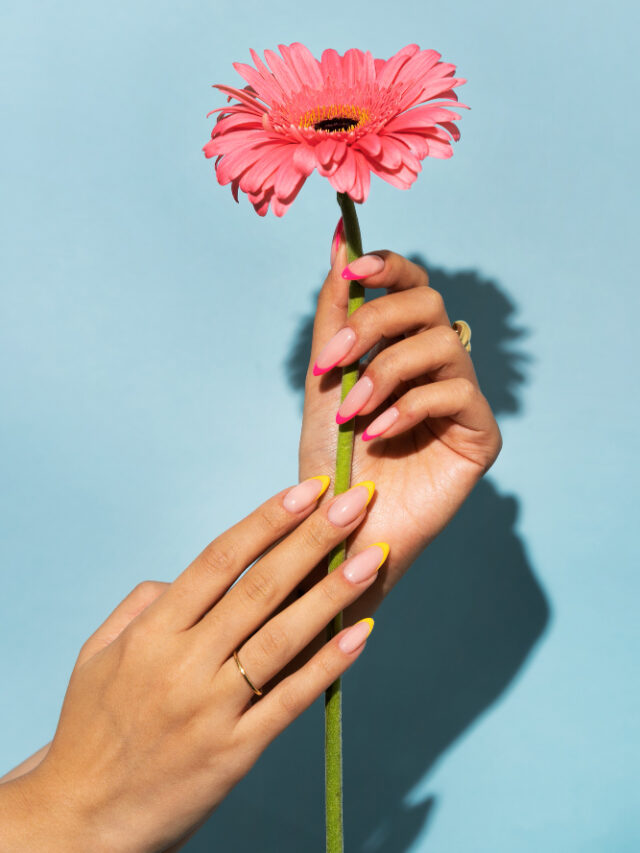 woman-showing-her-nail-art-fingernails-with-flower